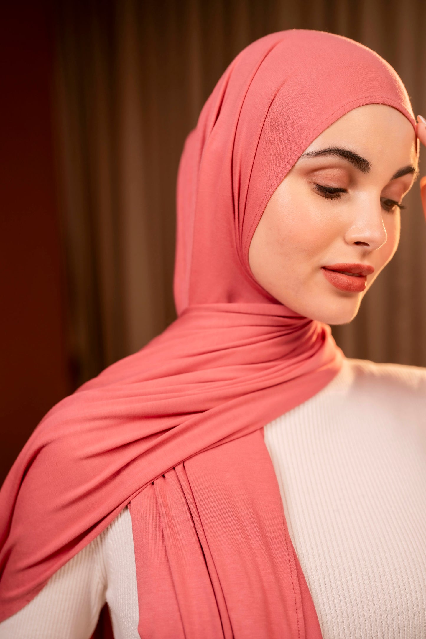Woman wearing a pink hijab with a blurred background