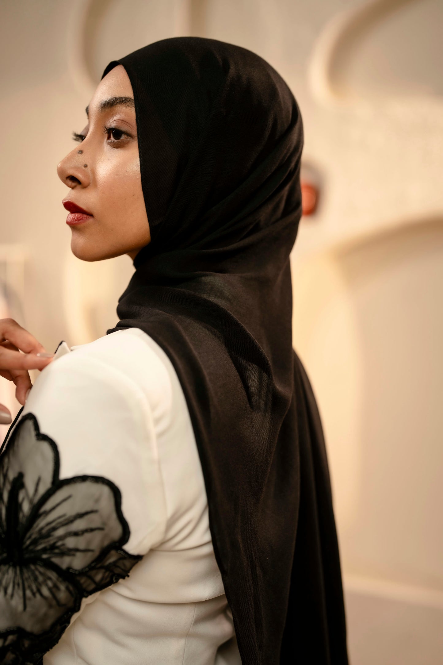 Woman wearing a black hijab with a blurred background