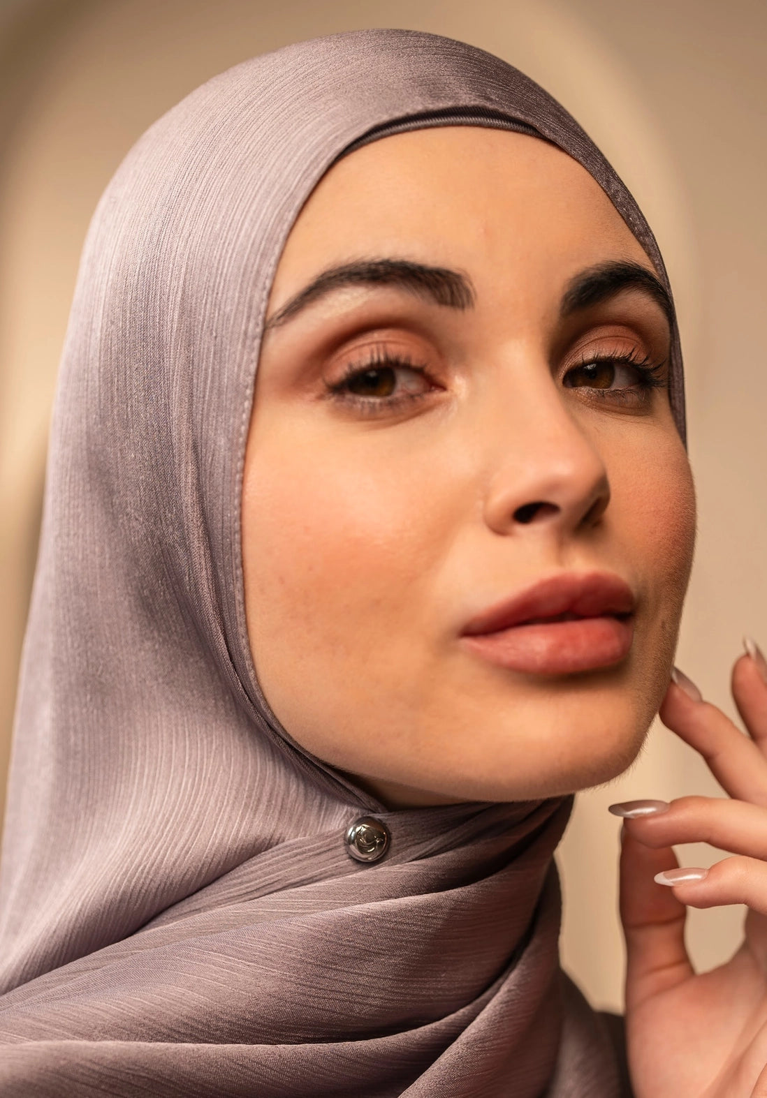 Woman wearing a hijab with a strong hijab magnet to keep it in place.