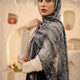 Black noir marble print modal hijab draped elegantly over a model, showcasing shades of black and gray.