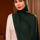 Woman wearing a dark green hijab against a dark background - Forest Green